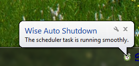 A Ballon popup showing that Wise Auto Shutdown Software is running smoothly in the background
